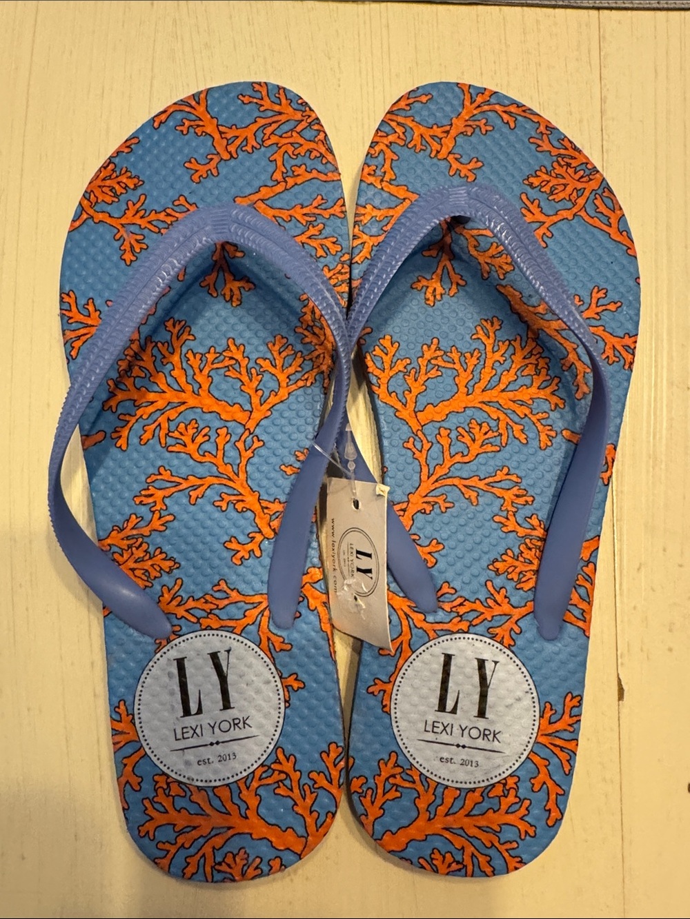 NWT Lexi York Flip Flops-size 8 in a blue and orange with a coral pattern-new!